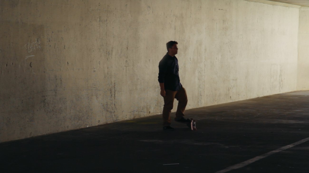 Image of teen boy in sihloette on a skateboard