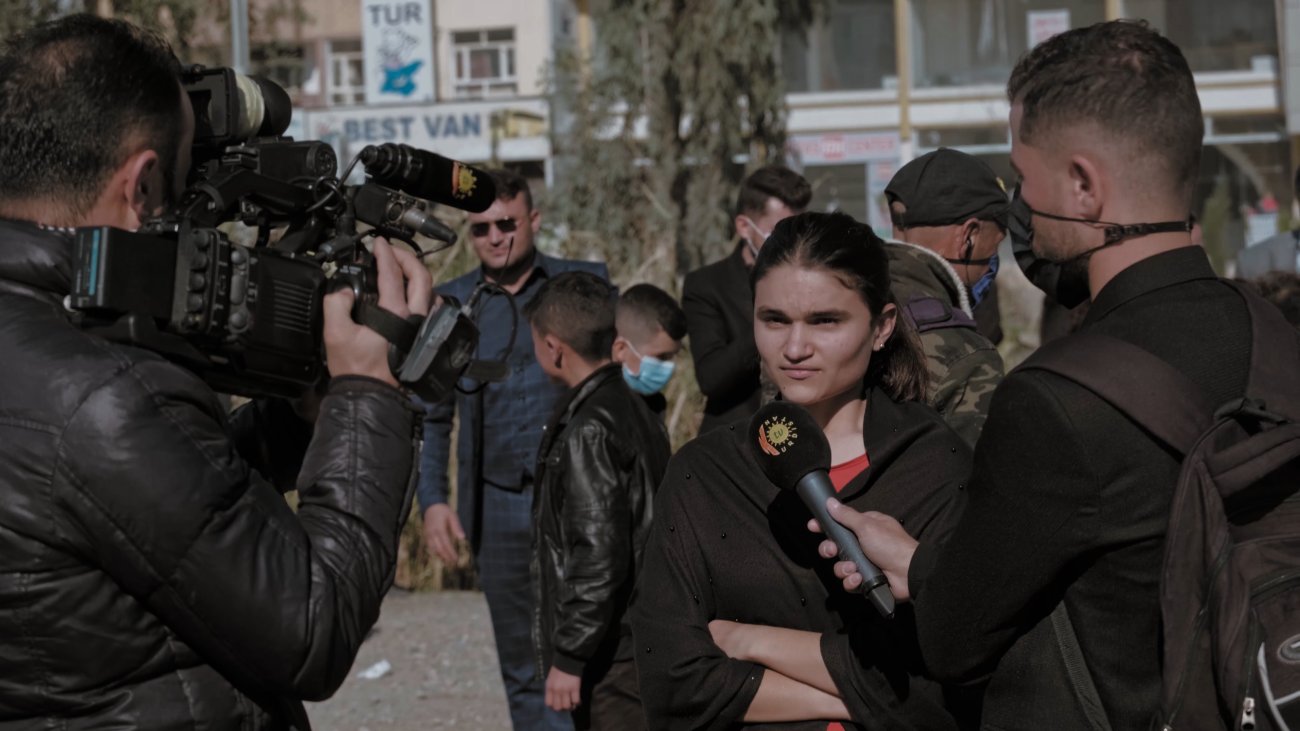 girl being interviewed by a camera crew